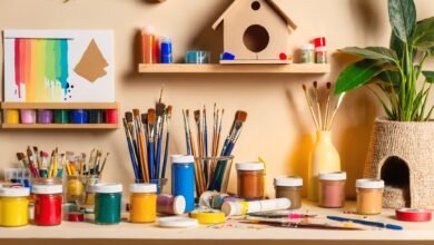 A colorful collection of arts and crafts supplies, including paints, brushes, yarns, and beads, neatly arranged on a wooden table, ready for creative projects.